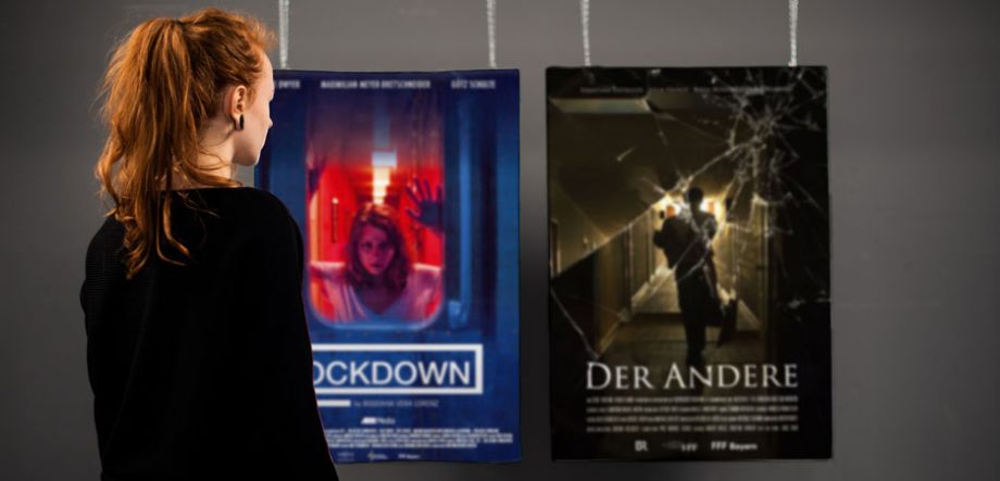 Photography of Nina Lesznik standing in front of hanging film posters "Lockdown" and "Der Andere"